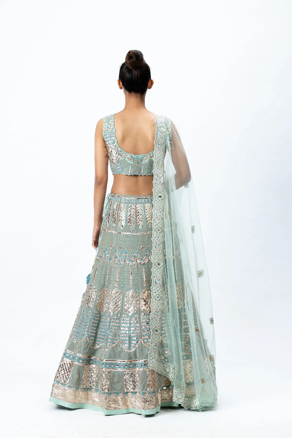 Mint Green Hand-embroidered Lehenga paired with Hand-embroidered Blouse, Hand-embroidered Dupatta and Hand-embroidered Jacket with Buttis