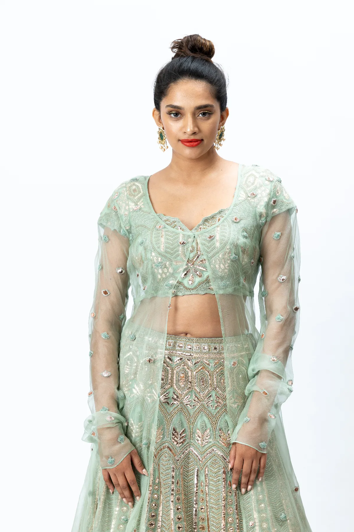 Mint Green Hand-embroidered Lehenga paired with Hand-embroidered Blouse, Hand-embroidered Dupatta and Hand-embroidered Long Jacket with Buttis