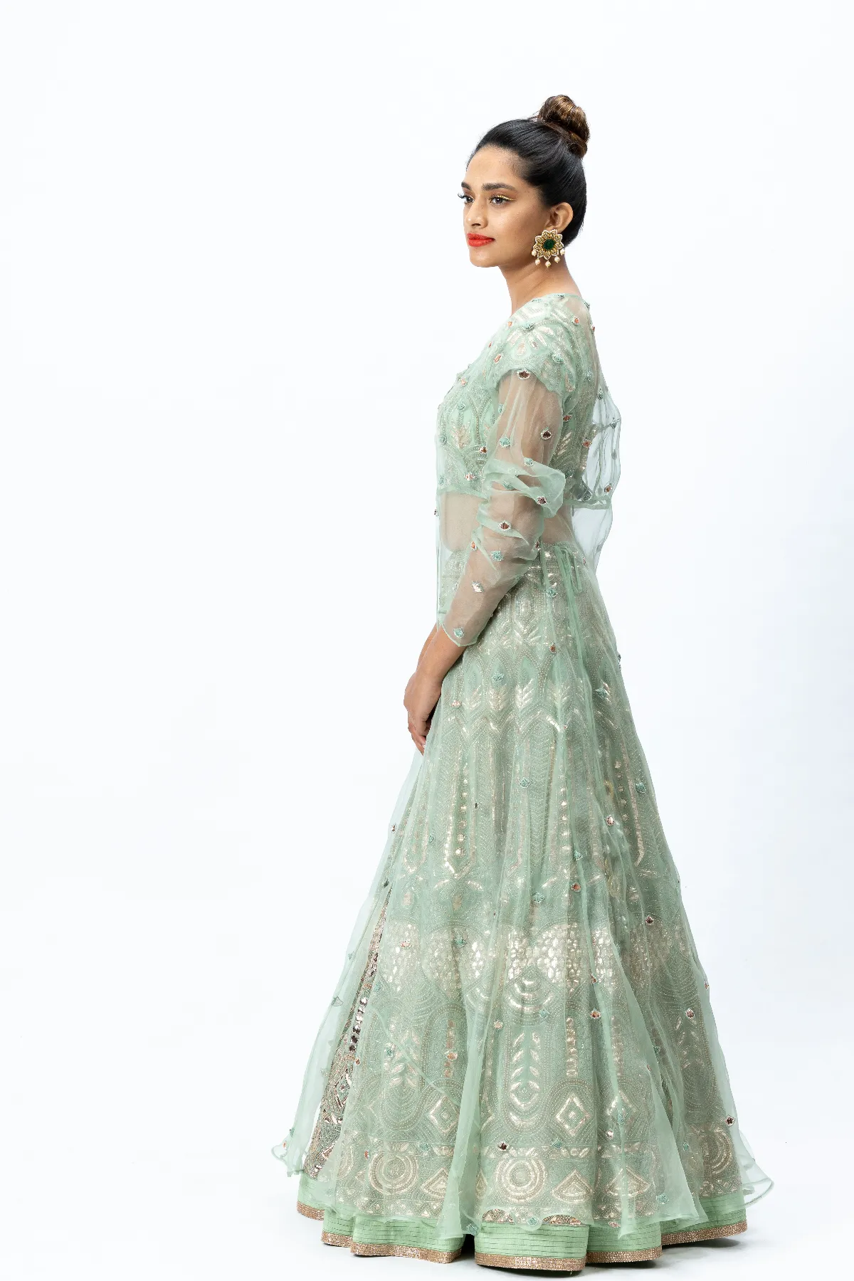 Mint Green Hand-embroidered Lehenga paired with Hand-embroidered Blouse, Hand-embroidered Dupatta and Hand-embroidered Long Jacket with Buttis