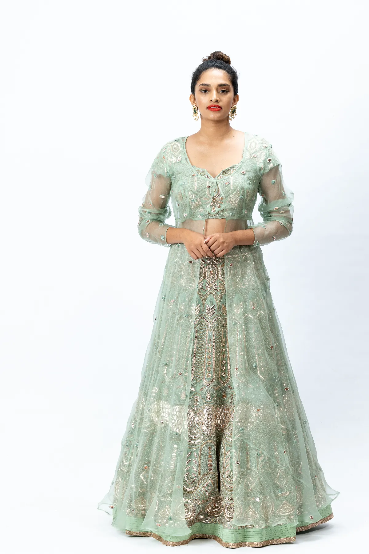 Mint Green Hand-embroidered Lehenga paired with Hand-embroidered Blouse, Hand-embroidered Dupatta and Hand-embroidered Long Jacket with Buttis