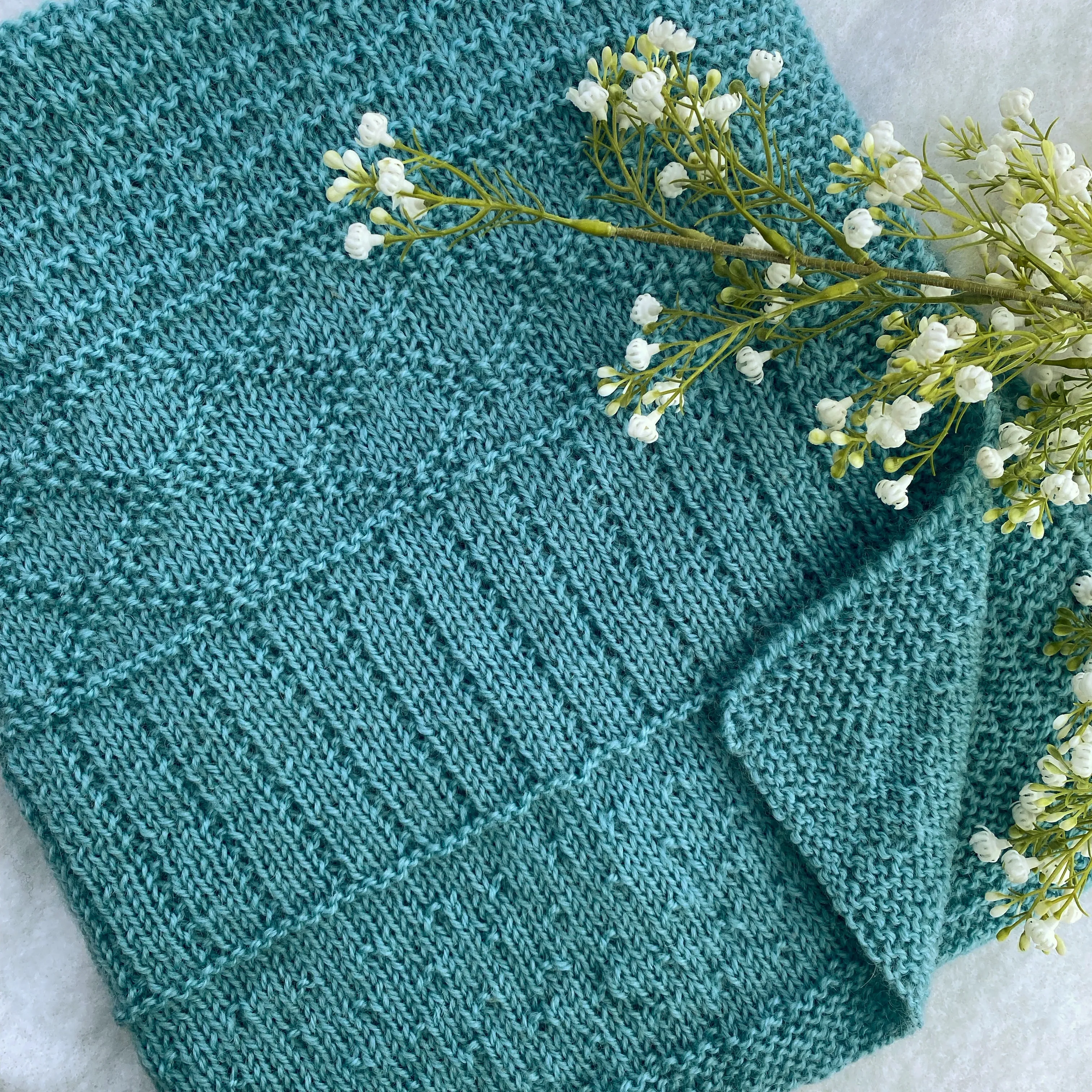 "Daisy" hand knit merino baby cot blanket